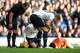 LIVERPOOL, ENGLAND - NOVEMBER 03: Hugo Lloris of Tottenham Hotspur lies injured during the Barclays Premier League match between Everton and Tottenham Hotspur at Goodison Park on November 03, 2013 in Liverpool, England. (Photo by Chris Brunskill/Getty Ima