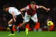 LONDON, ENGLAND - NOVEMBER 02: Aaron Ramsey of Arsenal clashes with Lucas Leiva of Liverpool during the Barclays Premier League match between Arsenal and Liverpool at Emirates Stadium on November 2, 2013 in London, England. (Photo by Laurence Griffiths/
