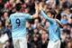 MANCHESTER, ENGLAND - NOVEMBER 02: David Silva of Manchester City celebrates scoring the second goal with his team-mates during the Barclays Premier League match between Manchester City and Norwich City at Etihad Stadium on November 2, 2013 in Manchester