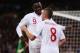 LONDON, ENGLAND - OCTOBER 12: Danny Welbeck of England celebrates with team-mate Tom Cleverley after scoring his team's fourth goal during the FIFA 2014 World Cup Group H qualifying match between England and San Marino at Wembley Stadium on October 12, 2