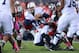 COLUMBUS, OH - OCTOBER 26: Quarterback Christian Hackenberg #14 of the Penn State Nittany Lions is sacked in the second quarter by Adolphus Washington #92 of the Ohio State Buckeyes at Ohio Stadium on October 26, 2013 in Columbus, Ohio. (Photo by Jamie