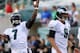 PHILADELPHIA, PA - AUGUST 09: Michael Vick #7 of the Philadelphia Eagles warms up as teamamte Nick Foles #9 stands by before the game against the New England Patriots on August 9, 2013 at Lincoln Financial Field in Philadelphia, Pennslyvania. (Photo by