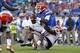 Nov 2, 2013; Jacksonville, FL, USA; Georgia Bulldogs defensive end Garrison Smith (56) sacks Florida Gators quarterback Tyler Murphy (3) during the second half at EverBank Field. Georgia Bulldogs defeated the Florida Gators 23-20. Mandatory Credit: Kim K