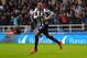 NEWCASTLE UPON TYNE, ENGLAND - NOVEMBER 02: Loic Remy of Newcastle United celebrates scoring their second goal during the Barclays Premier League match between Newcastle United and Chelsea at St James' Park on November 2, 2013 in Newcastle upon Tyne, Eng