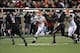 Nov 2, 2013; Lubbock, TX, USA; Oklahoma State Cowboys running back Desmond Roland (26) rushes against the Texas Tech Red Raiders in the second half at Jones AT&T Stadium. Mandatory Credit: Michael C. Johnson-USA TODAY Sports