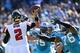 Nov 3, 2013; Charlotte, NC, USA; Atlanta Falcons quarterback Matt Ryan (2) passes the ball as Carolina Panthers defensive end Greg Hardy (76) pressures in the first quarter at Bank of America Stadium. Mandatory Credit: Bob Donnan-USA TODAY Sports