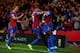 LONDON, ENGLAND - OCTOBER 21: Adrian Mariappa (2nd R) of Crystal Palace is congratulated by teammates after scoring the opening goal during the Barclays Premier League match between Crystal Palace and Fulham at Selhurst Park on October 21, 2013 in Londo