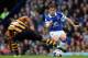 LIVERPOOL, ENGLAND - OCTOBER 19: Leighton Baines of Everton is tackled by Jake Livermore of Hull City during the Barclays Premier League match between Everton and Hull City at Goodison Park on October 19, 2013 in Liverpool, England. (Photo by Clive Bruns