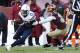 Nov 3, 2013; Landover, MD, USA; San Diego Chargers wide receiver Keenan Allen (13) runs with the ball as Washington Redskins strong safety Brandon Meriweather (31) attempts the tackle in the fourth quarter at FedEx Field. The Redskins won 30--24 in overti
