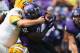 FORT WORTH, TX - SEPTEMBER 07: Waymon James #32 of the TCU Horned Frogs is tackled by Greg Triay #91 of the Southeastern Louisiana Lions and Kaleb Muse #33 at Amon G. Carter Stadium on September 7, 2013 in Fort Worth, Texas. (Photo by Ronald Martinez/Ge