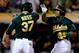 OAKLAND, CA - OCTOBER 04: Yoenis Cespedes #52 of the Oakland Athletics celebrates with teammate Brandon Moss #37 after hitting a two run home run in the seventh inning against Max Scherzer #37 of the Detroit Tigers during Game One of the American League
