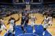 ORLANDO, FL - OCTOBER 18: Mike Conley #11 of the Memphis Grizzlies shoots against the Orlando Magic during the game on October 18, 2013 at Amway Center in Orlando, Florida. NOTE TO USER: User expressly acknowledges and agrees that, by downloading and or u