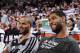 PORTLAND, OR - NOVEMBER 2: Tony Parker #9 and Tim Duncan #21 of the San Antonio Spurs smile and look on against the Portland Trailblazers on November 2, 2013 at the Moda Center Arena in Portland, Oregon. NOTE TO USER: User expressly acknowledges and agree