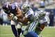 Nov 3, 2013; Arlington, TX, USA; Minnesota Vikings tight end Kyle Rudolph (82) breaks a tackle of Dallas Cowboys free safety Barry Church (42) and defensive back Jeff Heath (38) and runs for a touchdown in the third quarter at AT&T Stadium. The Dallas Cow
