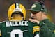 Nov 4, 2013; Green Bay, WI, USA; Green Bay Packers head coach Mike McCarthy talks with quarterback Seneca Wallace (9) during the first quarter against the Chicago Bears at Lambeau Field. Mandatory Credit: Jeff Hanisch-USA TODAY Sports