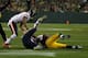 GREEN BAY, WI - NOVEMBER 04: Aaron Rodgers #12 of the Green Bay Packers is sacked by Shea McClellin #99 of the Chicago Bears with an assist from Isaiah Frey #31 at Lambeau Field on November 4, 2013 in Green Bay, Wisconsin. (Photo by Jonathan Daniel/Gett