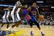 Nov 1, 2013; Memphis, TN, USA; Detroit Pistons center Greg Monroe (10) handles the ball against Memphis Grizzlies power forward Zach Randolph (50) during the second half at FedExForum. Memphis Grizzlies beat the Detroit Pistons 111 to 108. Mandatory Credi