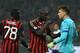 MILAN, ITALY - NOVEMBER 02: Mario Balotelli (C) of AC Milan defendes his team mate Mbaye Niang from Norberto Murara Neto (R) of ACF Fiorentina during the Serie A match between AC Milan and ACF Fiorentina at Stadio Giuseppe Meazza on November 2, 2013 in