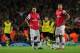 LONDON, ENGLAND - OCTOBER 22: Mesut Ozil and Olivier Giroud of Arsenal react after Robert Lewandowski of Borussia Dortmund (not pictured) scored their second goal during the UEFA Champions League Group F match between Arsenal and Borussia Dortmund at Em