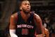 AUBURN HILLS, MI - NOVEMBER 3: Greg Monroe #10 of the Detroit Pistons shoots free-throws against the Boston Celtics during the game on November 3, 2013 at The Palace of Auburn Hills in Auburn Hills, Michigan. NOTE TO USER: User expressly acknowledges and