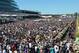 MELBOURNE, AUSTRALIA - NOVEMBER 05: Damien Oliver riding Fiorente walks out onto the track in front of a huge crowd before winning the Emirates Melbourne Cup during Melbourne Cup Day at Flemington Racecourse on November 5, 2013 in Melbourne, Australia.
