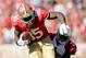 SAN FRANCISCO, CA - OCTOBER 13: Vernon Davis #85 of the San Francisco 49ers is tackled by Jerraud Powers #25 of the Arizona Cardinals after catching the ball at Candlestick Park on October 13, 2013 in San Francisco, California. (Photo by Ezra Shaw/Getty