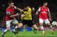 LONDON, ENGLAND - OCTOBER 22: Laurent Koscielny of Arsenal and Robert Lewandowski of Borussia Dortmund battle for the ball during the UEFA Champions League Group F match between Arsenal and Borussia Dortmund at Emirates Stadium on October 22, 2013 in Lo