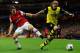 LONDON, ENGLAND - OCTOBER 22: Aaron Ramsey of Arsenal marshalls Marcel Schmelzer of Borussia Dortmund during the UEFA Champions League Group F match between Arsenal and Borussia Dortmund at Emirates Stadium on October 22, 2013 in London, England. (Phot