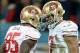 Oct 27, 2013; London, United Kingdom; San Francisco 49ers quarterback Colin Kaepernick (7) celebrates with tight end Vernon Davis (85) after scoring a touchdown against the Jacksonville Jaguars in the NFL International Series game at Wembley Stadium. Mand