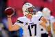 LANDOVER, MD - NOVEMBER 03: Quarterback Philip Rivers #17 of the San Diego Chargers throws a pass while warming up before the start of the Chargers game against the Washington Redskins at FedExField on November 3, 2013 in Landover, Maryland. (Photo by