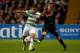 GLASGOW, SCOTLAND - OCTOBER 22: Emilio Izaguirre of Celtic is tackled by Lucas Andersen of Ajax during the UEFA Champions League Group H match between Celtic and Ajax at Celtic Park Stadium on October 22, 2013 in Glasgow, Scotland. (Photo by Jeff J Mitc