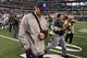 ARLINGTON, TX - OCTOBER 31: Injured quarterback Tony Romo of the Dallas Cowboys walks off the field with his head down after the Cowboys lost 35-17 against the Jacksonville Jaguars at Cowboys Stadium on October 31, 2010 in Arlington, Texas. (Photo by St