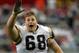 GLENDALE, AZ - SEPTEMBER 24: Guard Richie Incognito #68 of the St. Louis Rams waves goodbye to the home Arizona Cardinals crowd on September 24, 2006 at Cardinals Stadium in Glendale, Arizona. The Rams defeated the Cardinals 16-14. (Photo by Lisa Blumen