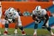 Sep 22, 2013; Miami Gardens, FL, USA; Miami Dolphins tackle Jonathan Martin (71), guard Richie Incognito (68), and center Mike Pouncey (51) prepare to block for quarterback Ryan Tannehill (17) as Atlanta Falcons defensive tackle Jonathan Babineaux (95)