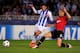 SAN SEBASTIAN, SPAIN - NOVEMBER 05: Nemanja Vidic of Manchester United tackles Carlos Vela of Real Sociedad during the UEFA Champions League Group A match between Real Sociedad de Futbol and Manchester United at Estadio Anoeta on November 5, 2013 in San