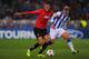 SAN SEBASTIAN, SPAIN - NOVEMBER 05: Chris Smalling of Manchester United battles with Antoine Griezmann of Real Sociedad during the UEFA Champions League Group A match between Real Sociedad and Manchester United at Estadio Anoeta on November 5, 2013 in Sa