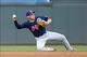 Asdrubal Cabrera makes a throw from his knees in a game against the Twins on Aug. 12.