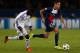 PARIS, FRANCE - NOVEMBER 05: Gregory van der Wiel of PSG is chased by Fabrice N'Sakala of Anderlecht during the UEFA Champions League Group C match between Paris Saint Germain and RSC Anderlecht at Parc des Princes on November 5, 2013 in Paris, France. (
