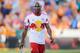 Nov 3, 2013; Houston, TX, USA; New York Red Bulls defender Jamison Olave (4) walks off the field after receiving a red card during the second half of the eastern conference semifinal game at BBVA Compass Stadium. Mandatory Credit: Andrew Richardson-USA TO