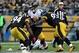Oct 20, 2013; Pittsburgh, PA, USA; Baltimore Ravens quarterback Joe Flacco (5) is sacked by Pittsburgh Steelers safety Troy Polamalu (43) linebacker Lawrence Timmons (94) and Jason Worilds (93) during the second half at Heinz Field. The Steelers won the g