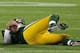 GREEN BAY, WI - NOVEMBER 04: Aaron Rodgers #12 of the Green Bay Packers lays on the ground after being sacked by Shea McClellin of the Chicago Bears at Lambeau Field on November 4, 2013 in Green Bay, Wisconsin. (Photo by Jonathan Daniel/Getty Images)