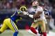 ST. LOUIS, MO - DECEMBER 02: Wide receiver Michael Crabtree #15 of the San Francisco 49ers is pushed out of bounds by free safety Quintin Mikell #27 of the St. Louis Rams during the game at the Edward Jones Dome on December 02, 2012 in St. Louis, Missouri