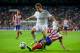 MADRID, SPAIN - SEPTEMBER 28: Fabio Coentrao of Real Madrid CF competes for the ball with Juan Francisco Torres alias Juanfran of Atletico de Madrid during the La Liga match between Real Madrid CF and Club Atletico de Madrid at Estadio Santiago Bernabeu o