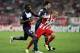 ATHENS, GREECE - SEPTEMBER 17: Vladimir Weiss (R) of Olympiacos FC is challenged by Blaise Matuidi of Paris Saint-Germain FC during the UEFA Champions League group stage match between Olympiacos FC and Paris Saint-Germain FC held on September 17, 2013 at