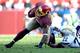 LANDOVER, MD - NOVEMBER 03: Pierre Garcon #88 of the Washington Redskins is tackled by Derek Cox #22 of the San Diego Chargers in the second quarter during an NFL game at FedExField on November 3, 2013 in Landover, Maryland. (Photo by Patrick McDermott/