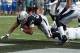 Nov 3, 2013; Oakland, CA, USA; Oakland Raiders running back Rashad Jennings (27) eludes Philadelphia Eagles linebacker Brandon Graham (55) to score on an 8-yard touchdown run in the second quarter at O.co Coliseum. Mandatory Credit: Kirby Lee-USA TODAY Sp