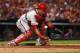 ST. LOUIS, MO - JULY 24: Carlos Ruiz #51 of the Philadelphia Phillies bobbles a bunt against the St. Louis Cardinals in the fitth inning at Busch Stadium on July 24, 2013 in St. Louis, Missouri. The Cardinals beat the Phillies 11-3. (Photo by Dilip Vish