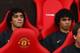 MANCHESTER, UNITED KINGDOM - AUGUST 06: Rafael Da Silva (L) sits on the bench beside his twin brother and team mate Fabio Da Silva of Manchester United prior to the Pre Season Friendly match between Manchester United and Juventus at Old Trafford on Augus