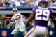 ARLINGTON, TX - NOVEMBER 03: Quarterback Tony Romo #9 of the Dallas Cowboys passes as cornerback Xavier Rhodes #29 of the Minnesota Vikings defends during the game at Cowboys Stadium on November 3, 2013 in Arlington, Texas. (Photo by Jamie Squire/Getty