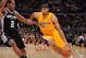 LOS ANGELES, CA - NOVEMBER 1: Xavier Henry #7 of the Los Angeles Lakers drives to the basket against Kawhi Leonard #2 of the San Antonio Spurs on November 1, 2013 at STAPLES Center in Los Angeles, California. NOTE TO USER: User expressly acknowledges and